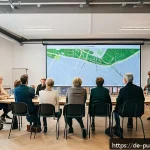 Home 20 공공정책을 위한 전략적 접근 - A diverse group of German citizens gathered in a modern Berlin community center for a city developme...